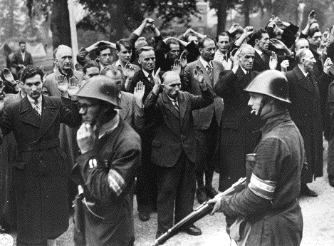 A Round-up of
                                                          Collaborators
                                                          by Dutch
                                                          troops.